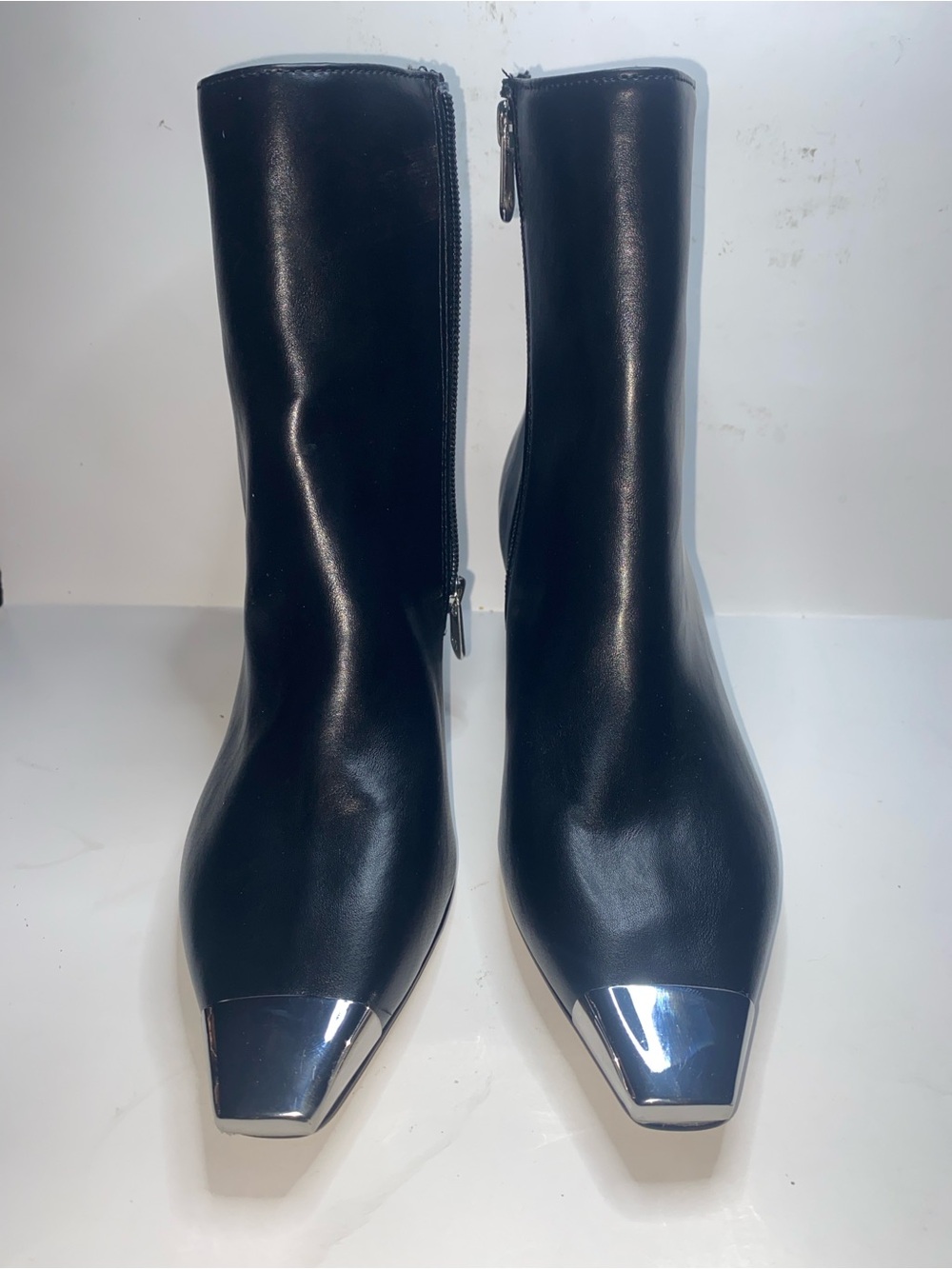 Adrienne Vittadini Black Leather Ankle Boots with Silver Cap Toe display